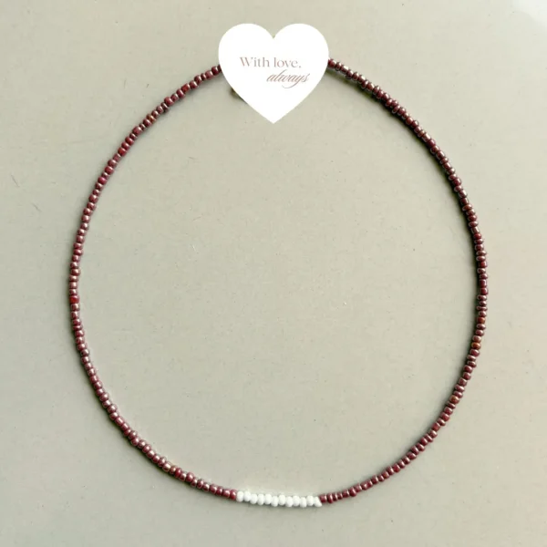 A timeless piece handcrafted with rich maroon beads