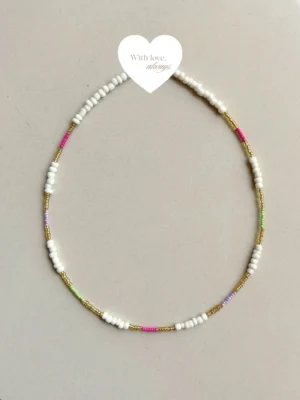 Playful beaded necklace with soft pastel pops and golden accents