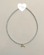 Handcrafted necklace features soft blue crystal beads