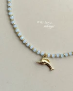 Handcrafted necklace features soft blue crystal beads