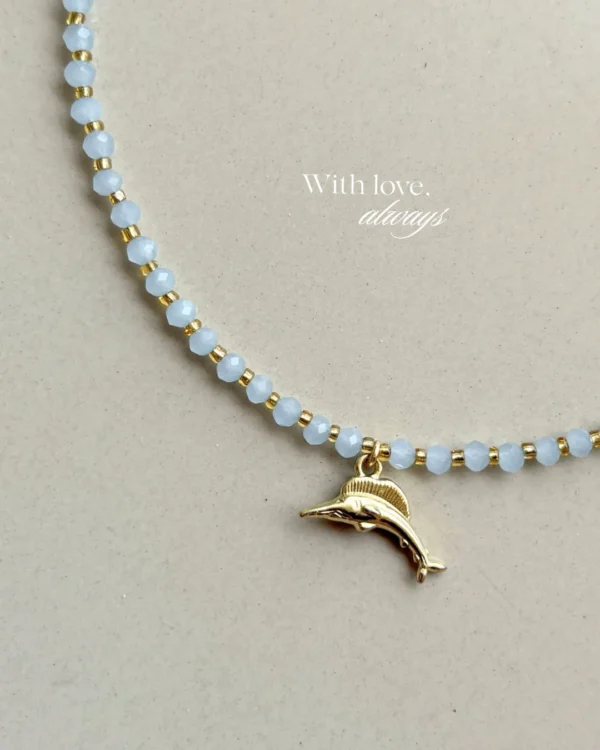 Handcrafted necklace features soft blue crystal beads