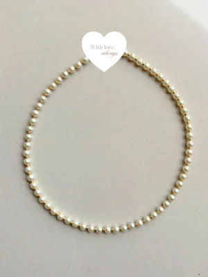 Classic pearl detailing paired with gold accents
